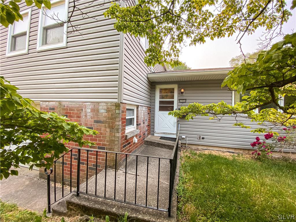 1934 Windsor Road Bethlehem, PA 18017 - Photo 3 of 32 a view of a house with a yard and a garden