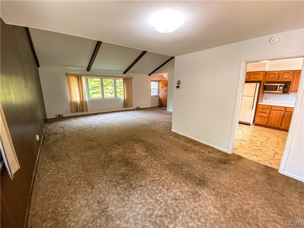 1934 Windsor Road Bethlehem, PA 18017 - Photo 6 of 32 en empty room with windows and fireplace