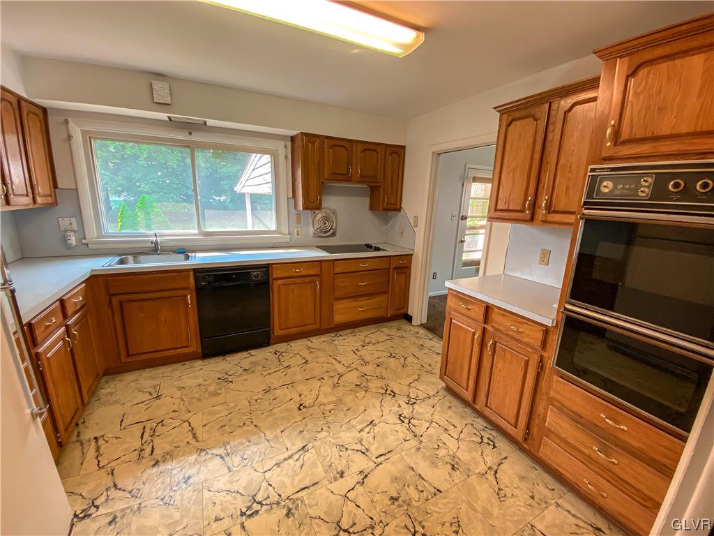 1934 Windsor Road Bethlehem, PA 18017 - Photo 10 of 32 a kitchen with stainless steel appliances granite countertop a refrigerator and a stove top oven