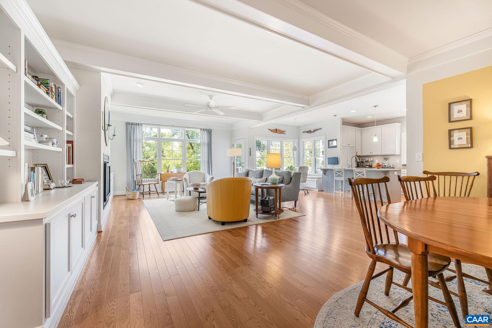 537 Trailside Drive Charlottesville, VA 22911 - Photo 12 of 52 a view of a dining room and livingroom with furniture wooden floor a chandelier