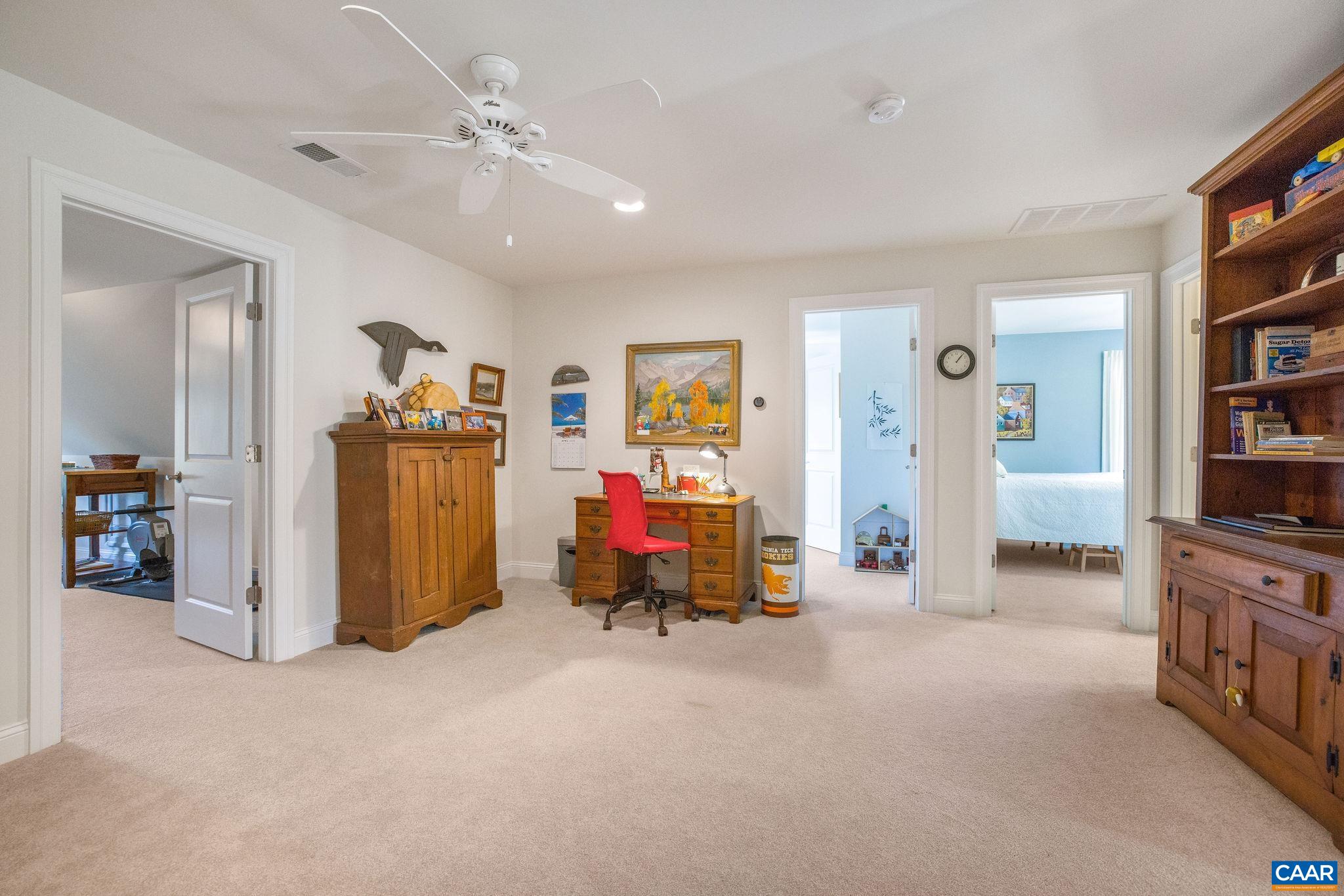 537 Trailside Drive Charlottesville, VA 22911 - Photo 27 of 52 a view of a livingroom with furniture and a ceiling fan