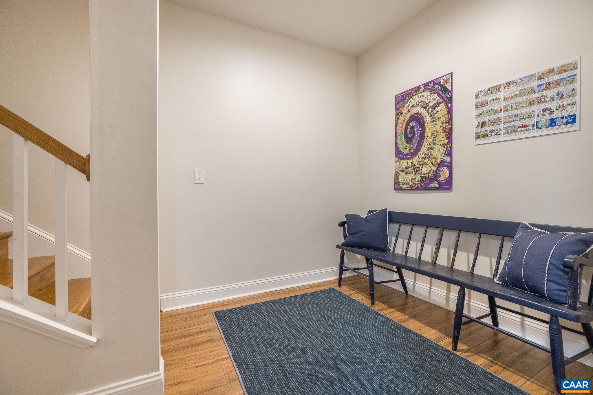 537 Trailside Drive Charlottesville, VA 22911 - Photo 35 of 52 a view of a hallway with wooden floor and a potted plant