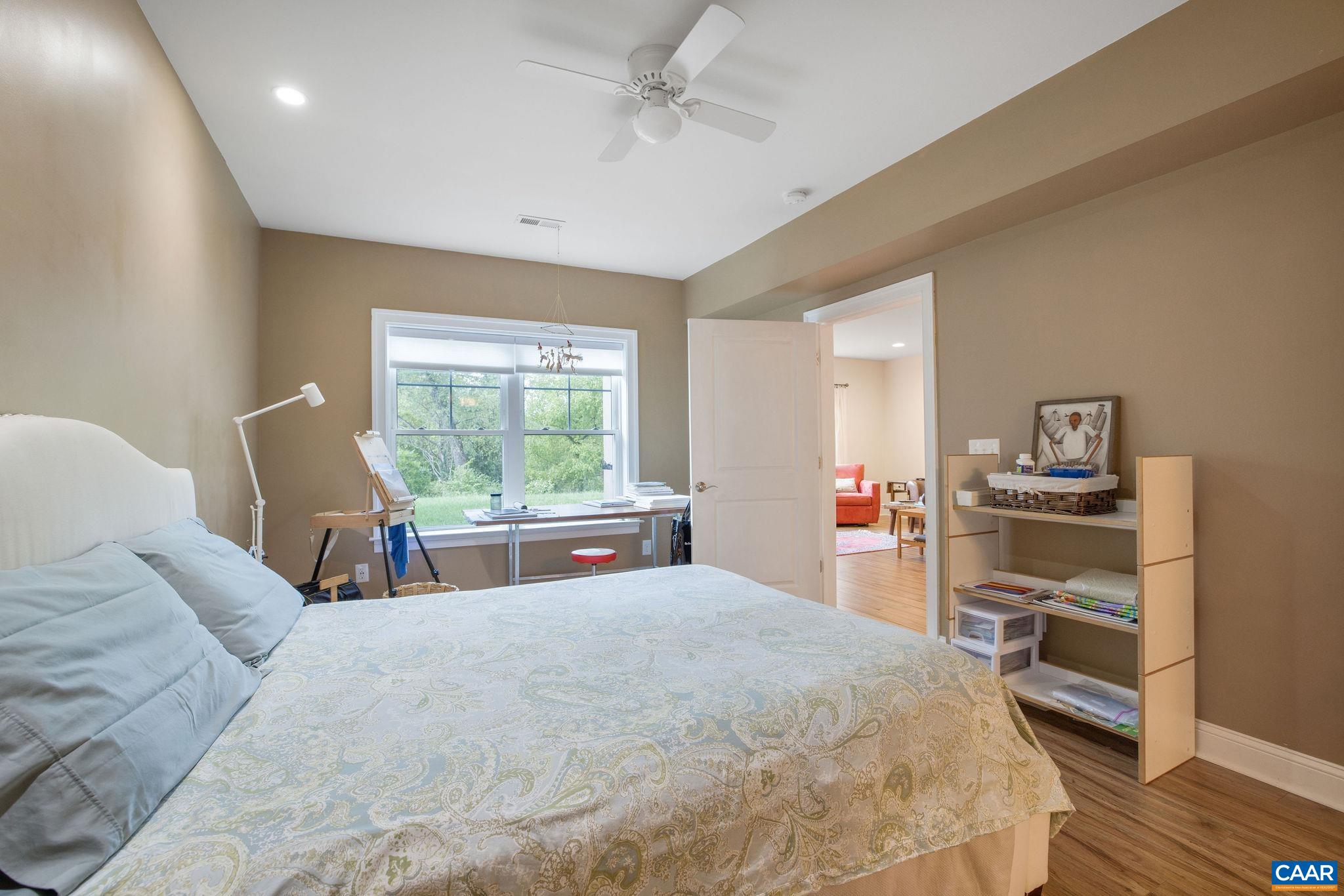 537 Trailside Drive Charlottesville, VA 22911 - Photo 42 of 52 a bed sitting in a bedroom next to a window