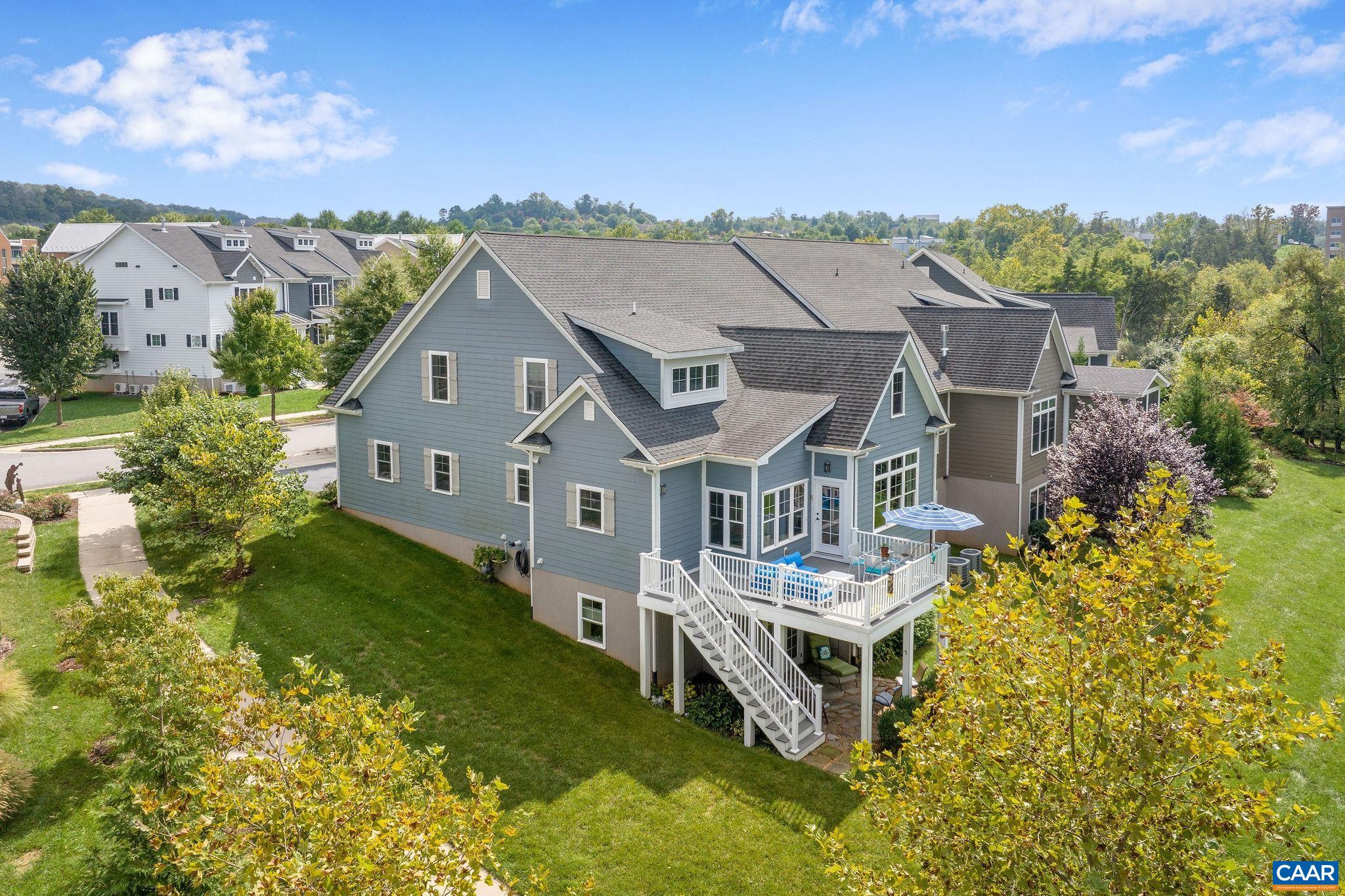 537 Trailside Drive Charlottesville, VA 22911 - Photo 6 of 52 a aerial view of a house with a big yard and large tree