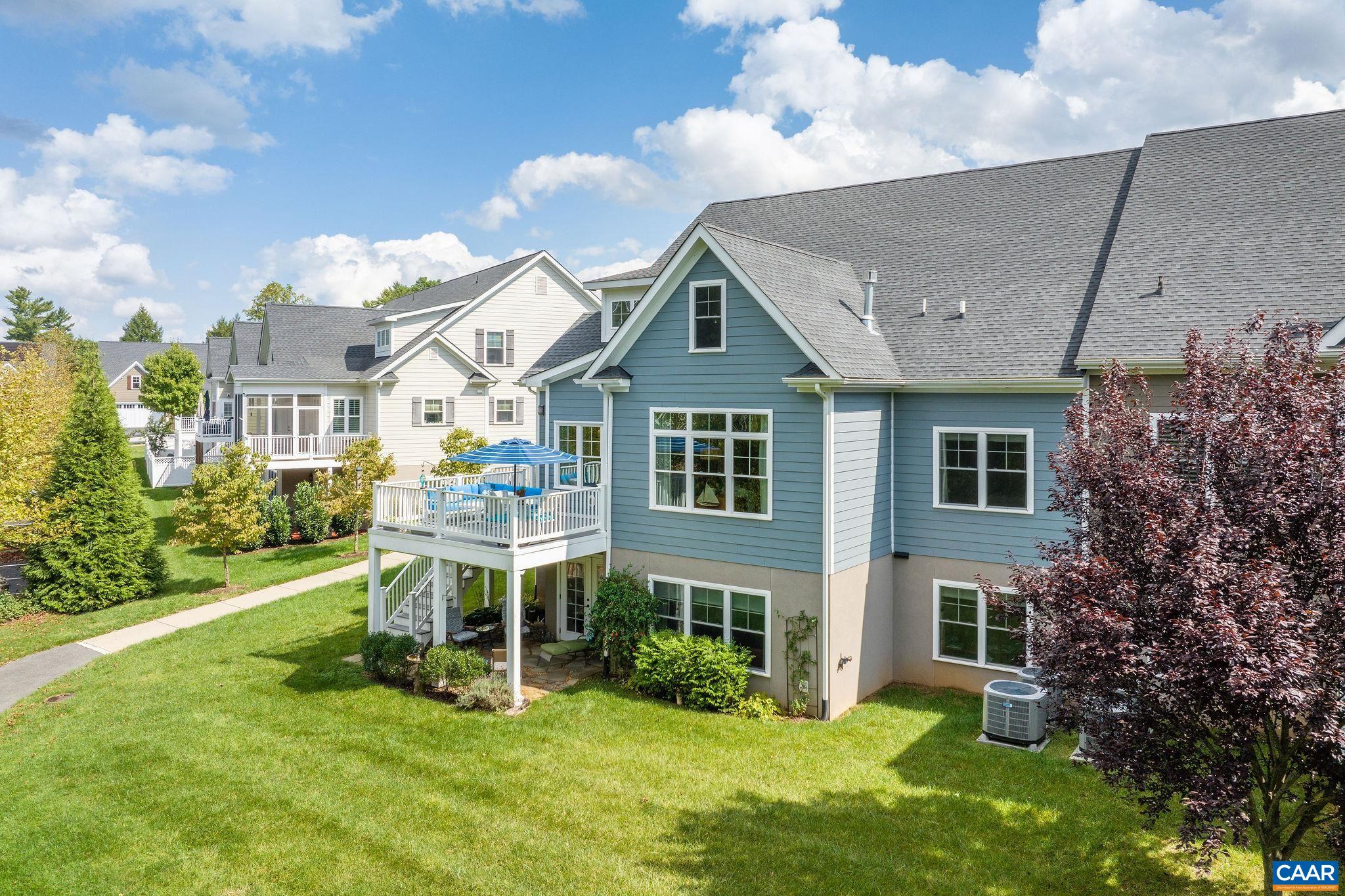 537 Trailside Drive Charlottesville, VA 22911 - Photo 7 of 52 a patio with table and chairs and potted plants
