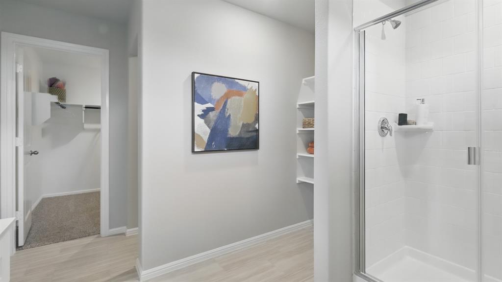 269 Cal Frd Drive Justin, TX 76247 - Photo 23 of 35 a bathroom with a shower and a glass door