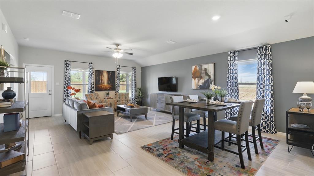 269 Cal Frd Drive Justin, TX 76247 - Photo 7 of 35 a living room with fireplace furniture and a flat screen tv