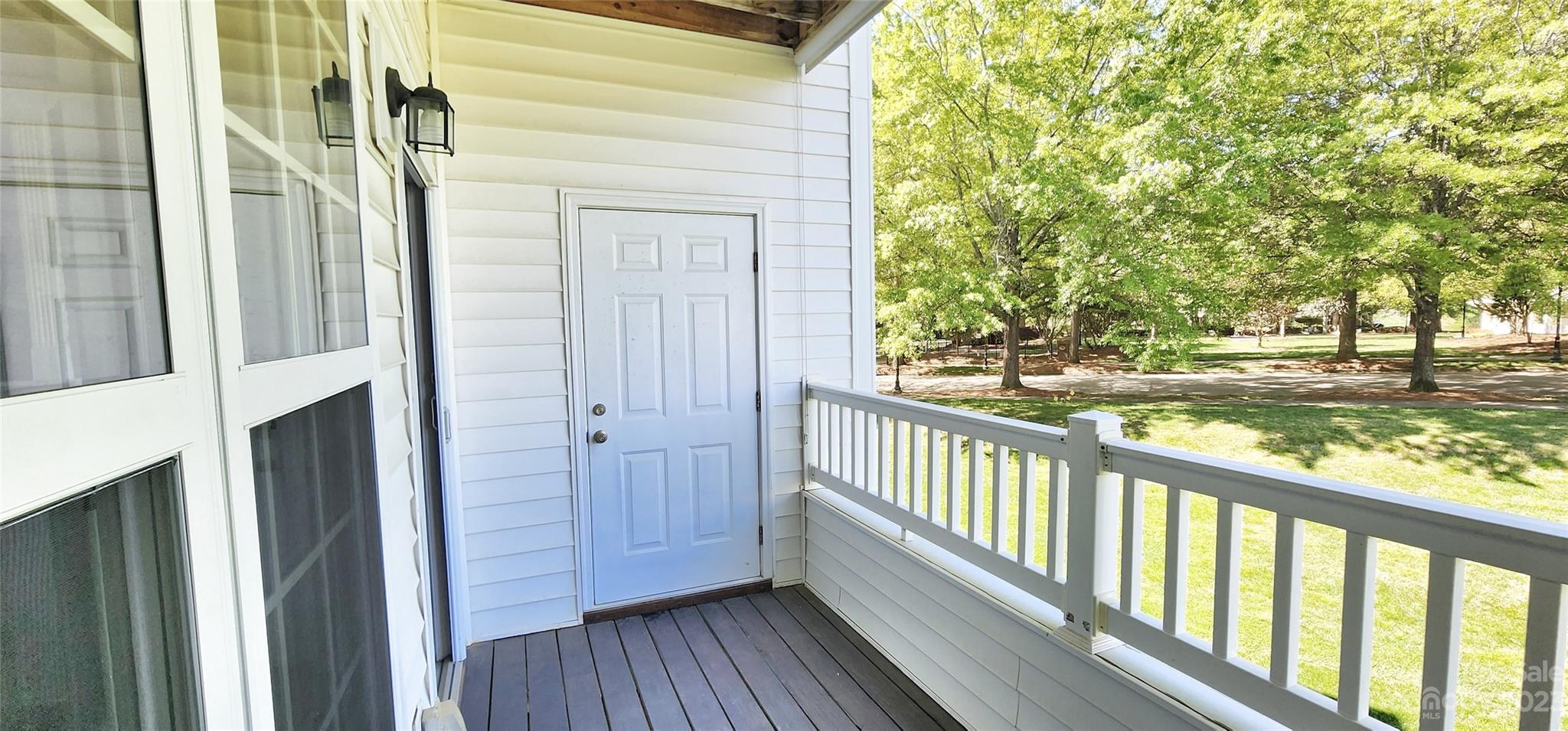 10125 Westmoreland Road, Unit 2D Cornelius, NC 28031 - Photo 8 of 36 a view of a balcony with wooden floor