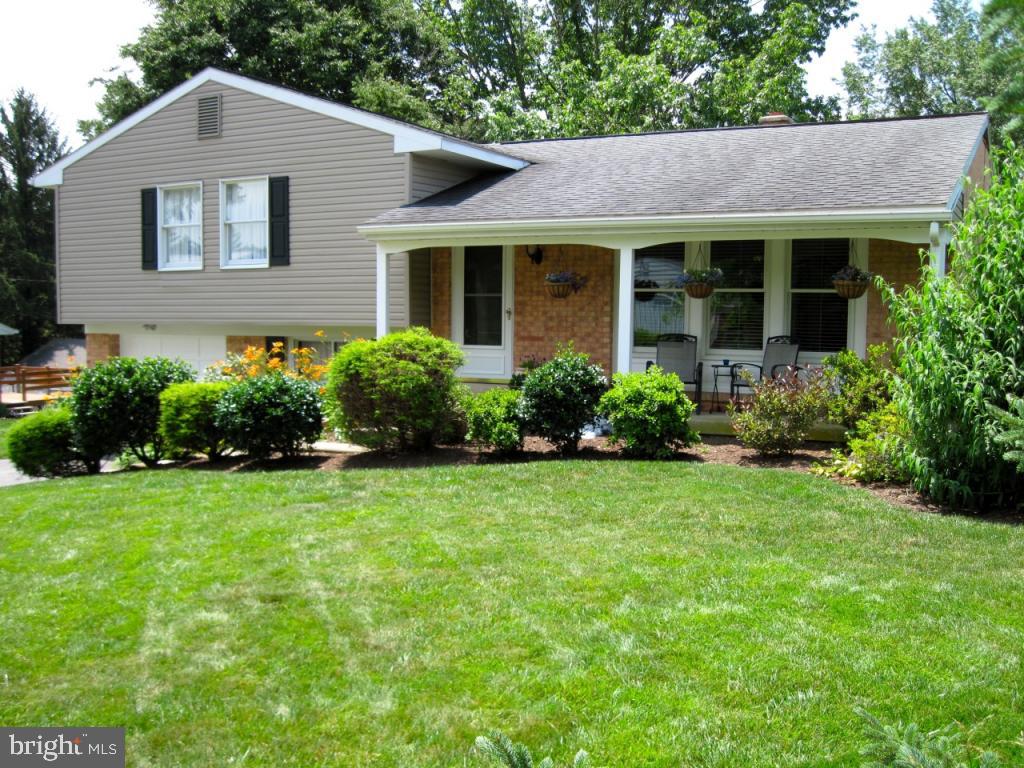 a view of a house with garden and yard