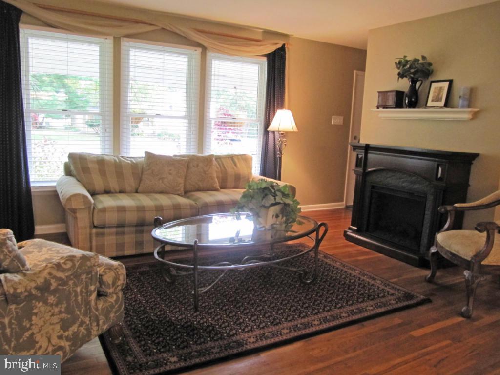 1033 Preston Road Lancaster, PA 17601 - Photo 4 of 35 a living room with furniture and a fireplace