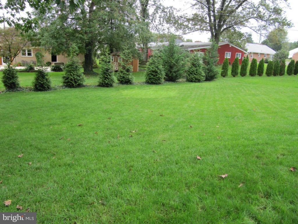 1033 Preston Road Lancaster, PA 17601 - Photo 33 of 35 a view of a garden with a building in the background
