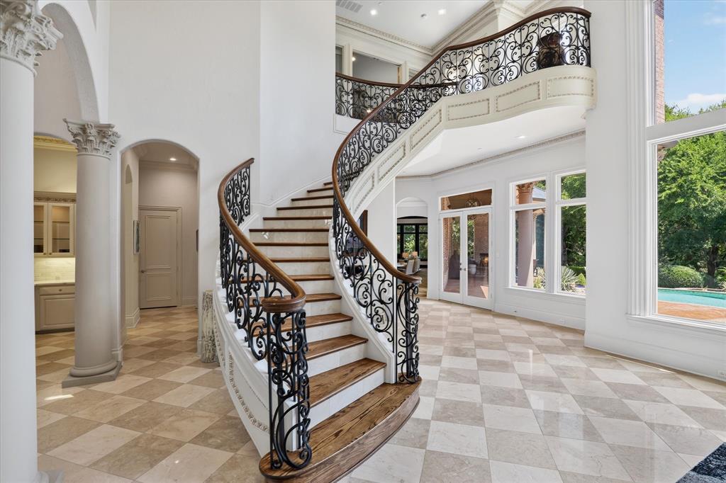 6512 Old Gate Road Plano, TX 75024 - Photo 11 of 40 The floating stairway adds just the right amount of WOW to this room.
