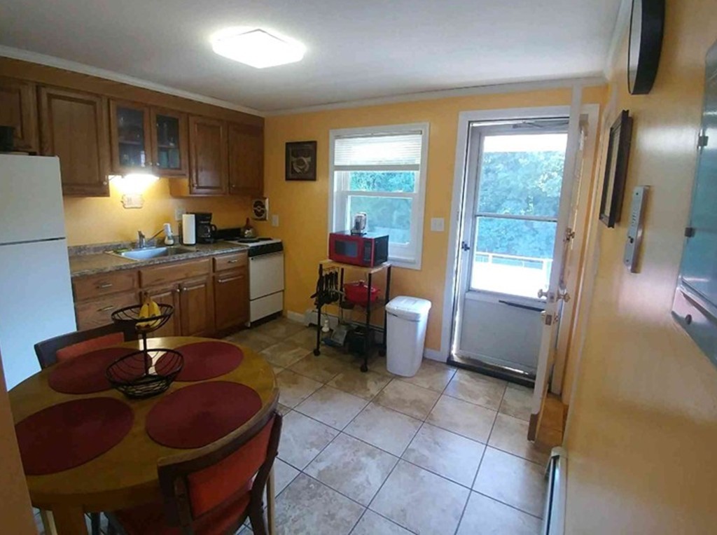 2 Colonial Drive, Unit 6 Andover, MA 01810 - Photo 1 of 12 a room with furniture or couch and a window