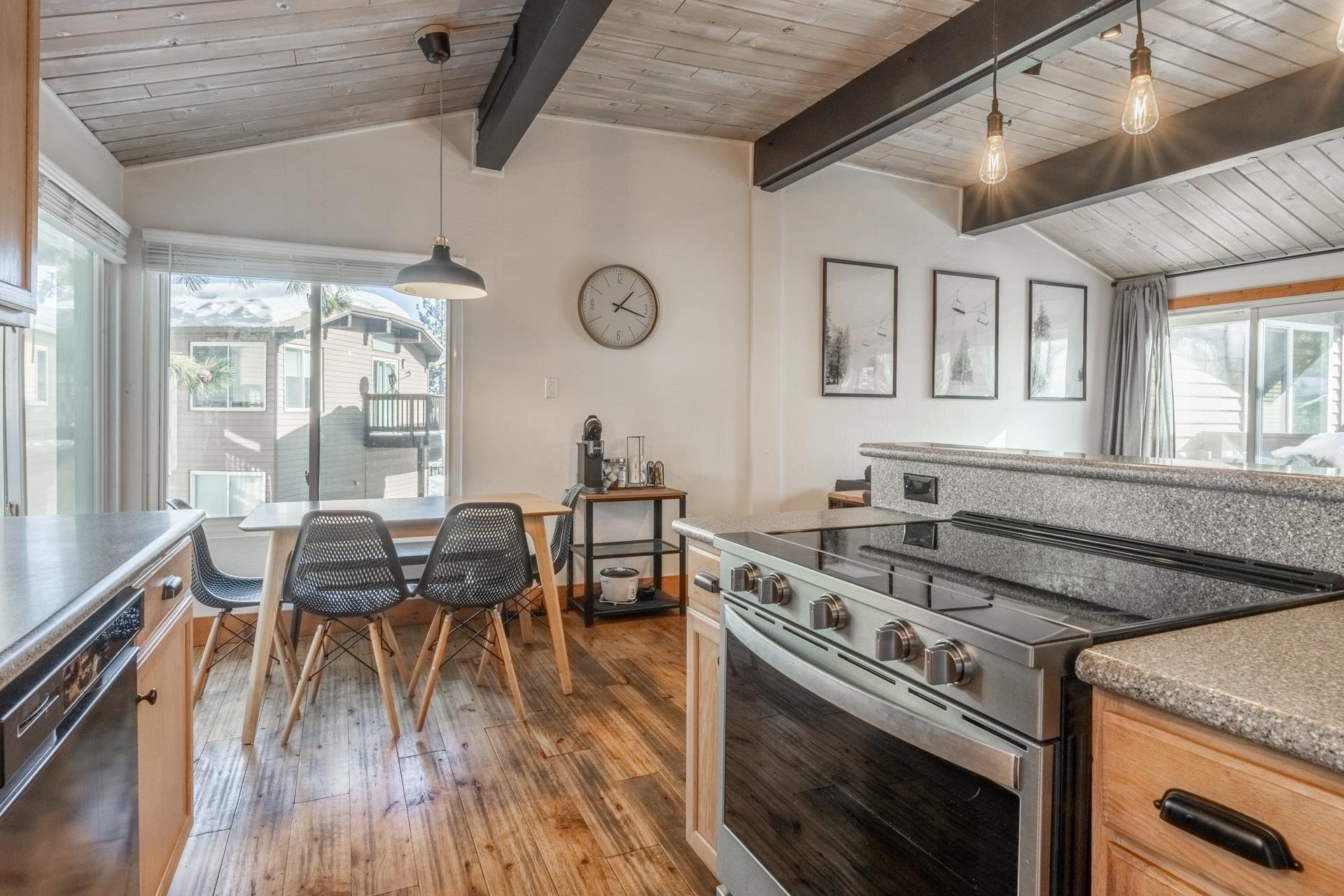 2290 Sierra Nevada Road, Unit 43 Mammoth Lakes, CA 93546 - Photo 14 of 33 a kitchen with a stove a sink a dining table and chairs