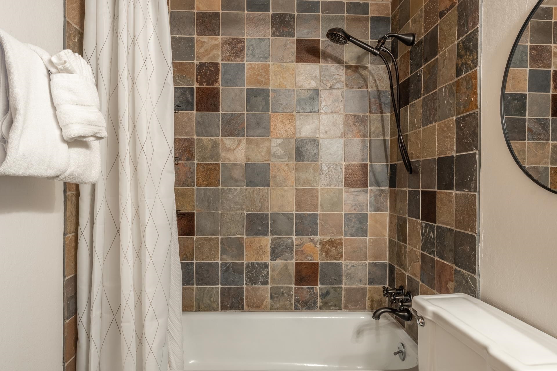 2290 Sierra Nevada Road, Unit 43 Mammoth Lakes, CA 93546 - Photo 17 of 33 a bathroom with a bathtub and a shower