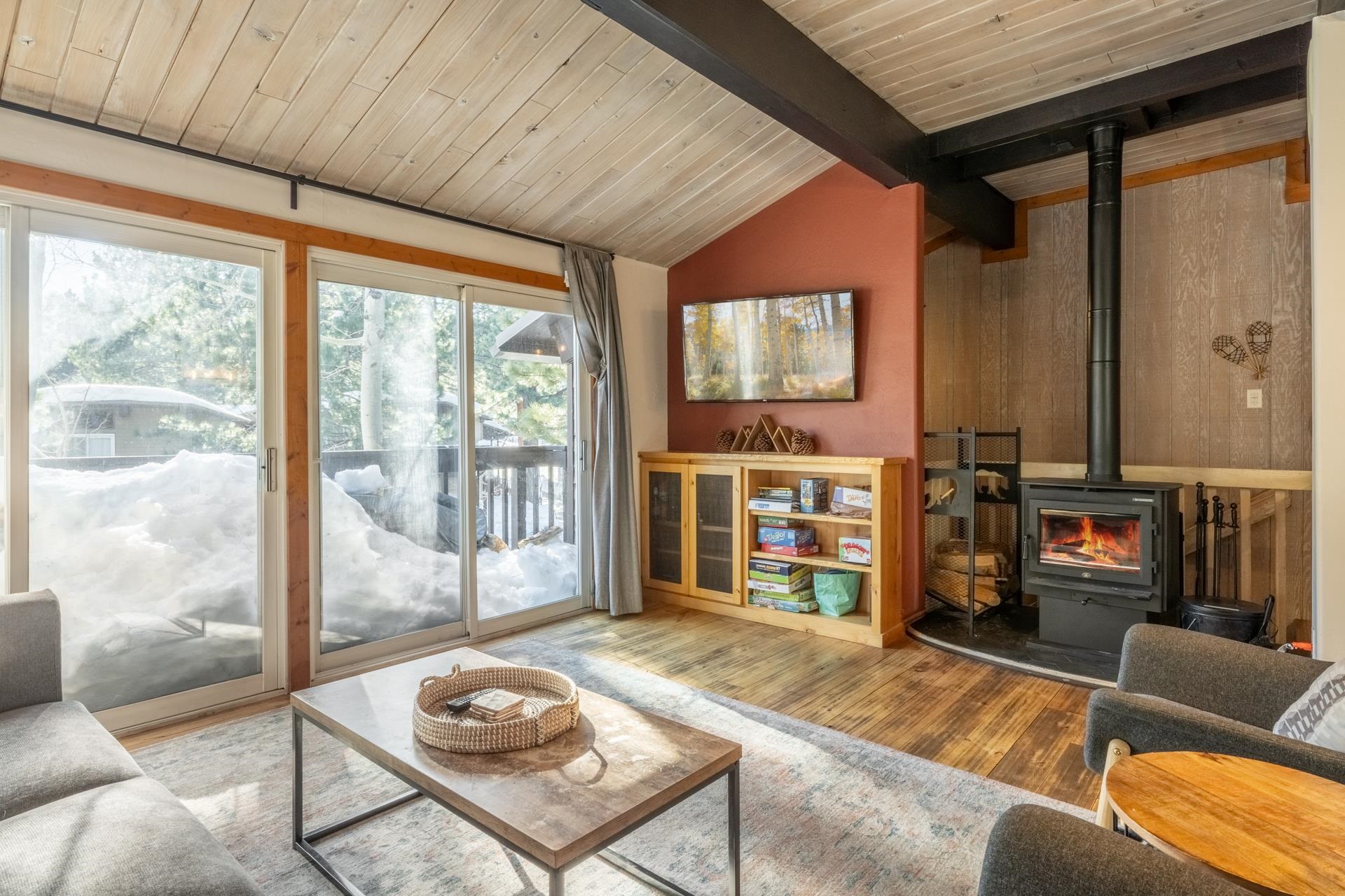2290 Sierra Nevada Road, Unit 43 Mammoth Lakes, CA 93546 - Photo 2 of 33 a living room with fireplace furniture and a flat screen tv