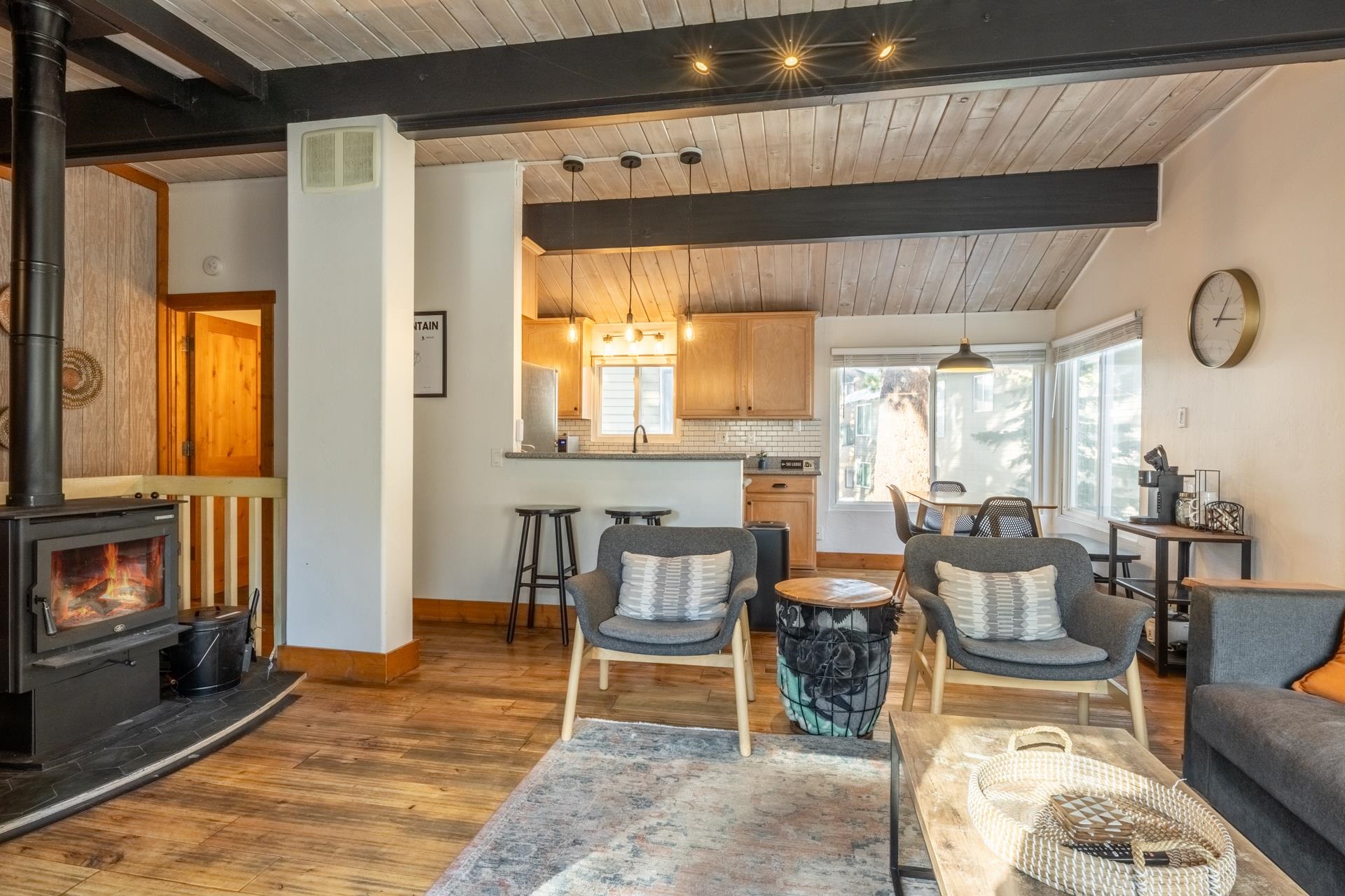 2290 Sierra Nevada Road, Unit 43 Mammoth Lakes, CA 93546 - Photo 8 of 33 a dining room with furniture a fireplace and large window