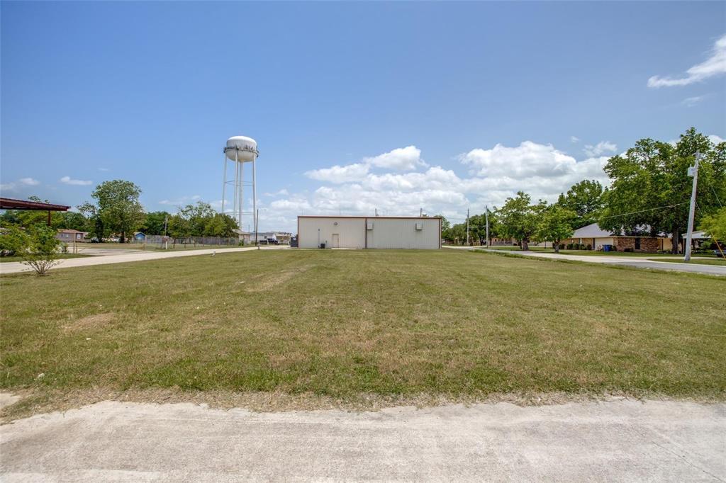 529 North 4th Street Princeton, TX 75407 - Photo 7 of 9 a view of a fountain in front of a house with a big yard