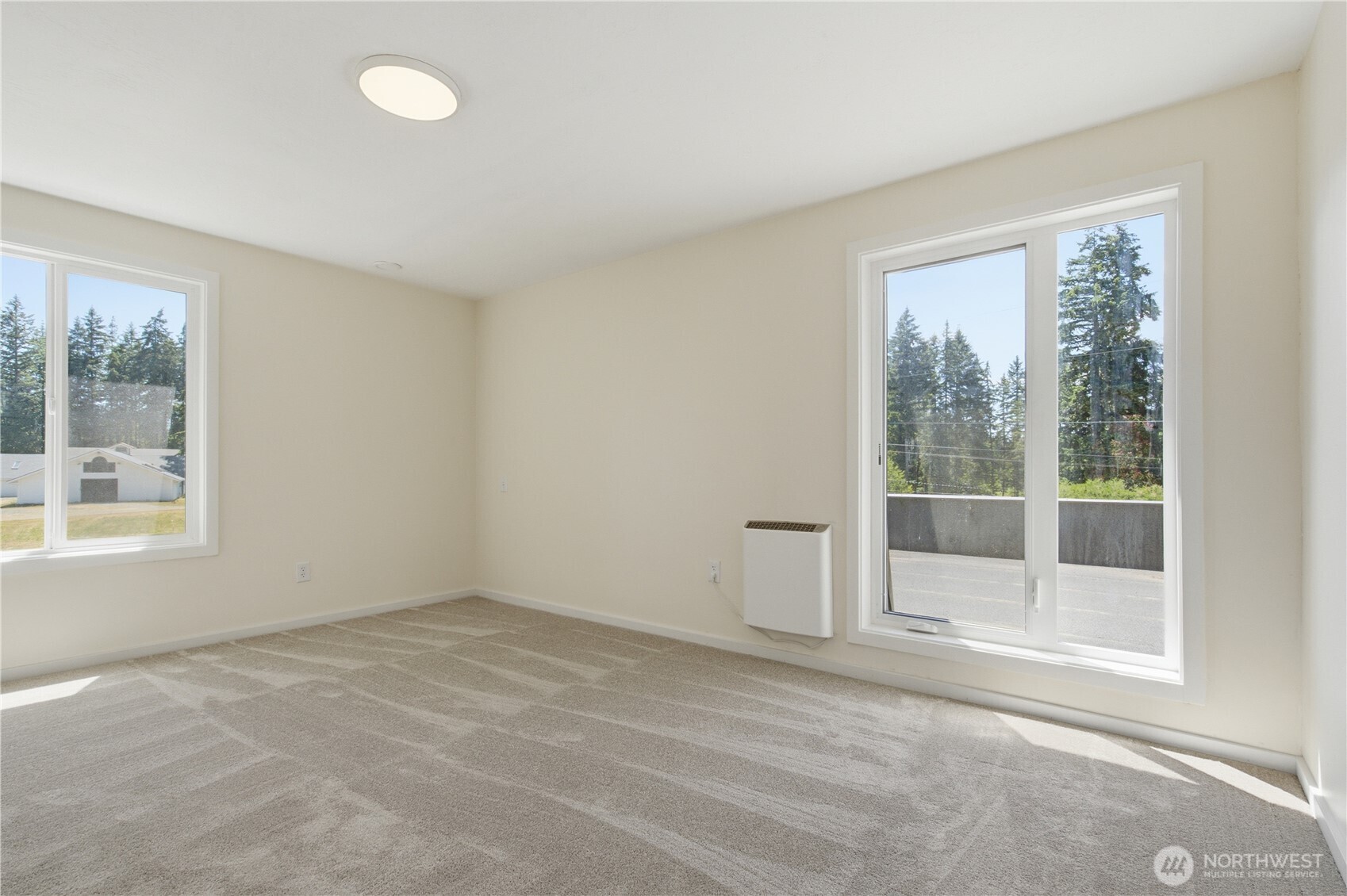 3050 Southeast Mullenix Road Port Orchard, WA 98367 - Photo 17 of 40 an empty room with windows