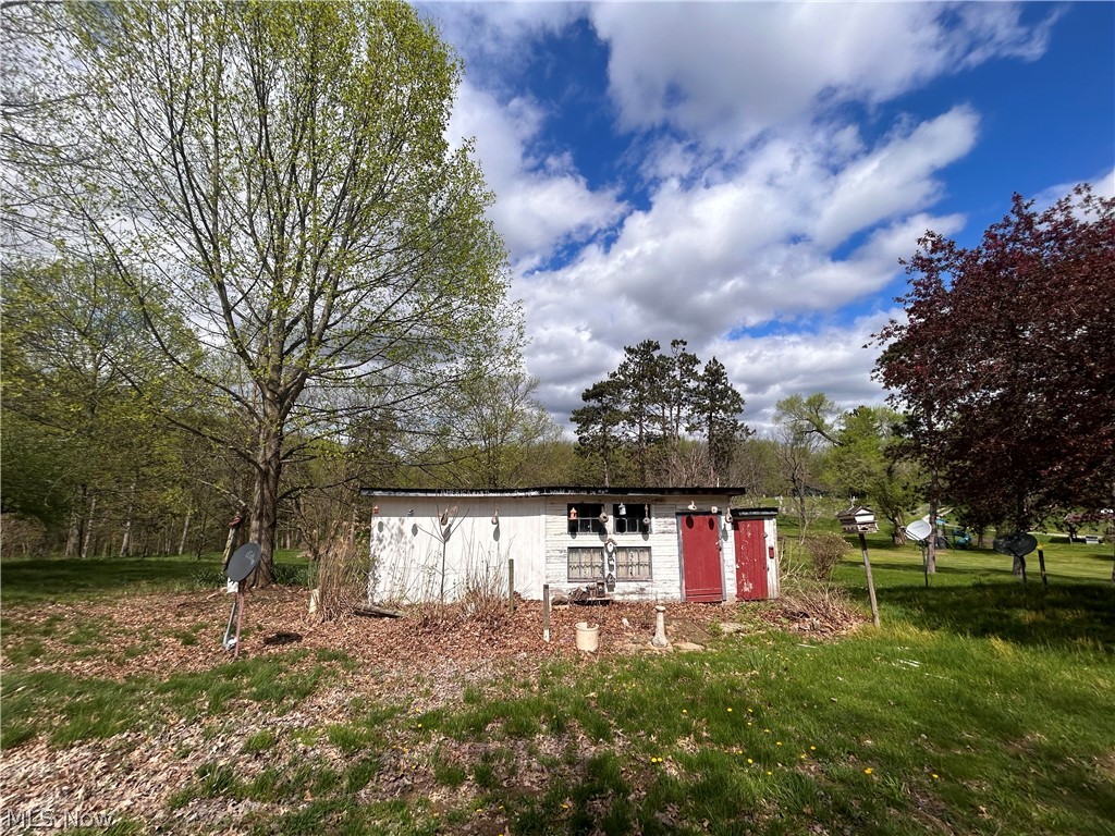 26057 Cadiz Road Freeport, OH 43973 - Photo 4 of 24 View of yard featuring a hobby shed