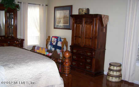 97285 Castle Ridge Drive Yulee, FL 32097 - Photo 12 of 23 a bed room with a bed and a closet
