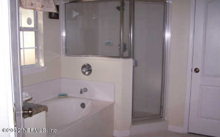 97285 Castle Ridge Drive Yulee, FL 32097 - Photo 13 of 23 a bathroom with a tub and a sink