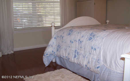 97285 Castle Ridge Drive Yulee, FL 32097 - Photo 18 of 23 a bedroom with a bed and a window