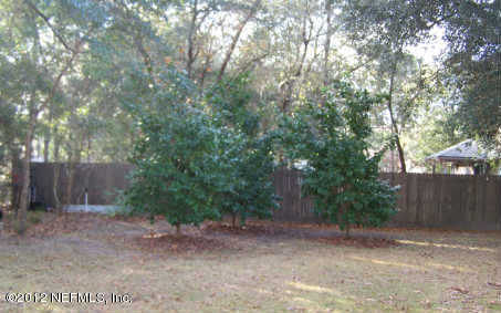 97285 Castle Ridge Drive Yulee, FL 32097 - Photo 19 of 23 a view of a backyard