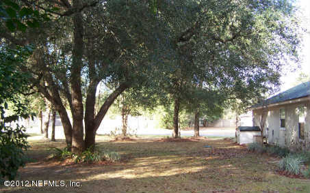 97285 Castle Ridge Drive Yulee, FL 32097 - Photo 20 of 23 a view of a yard with plants and trees