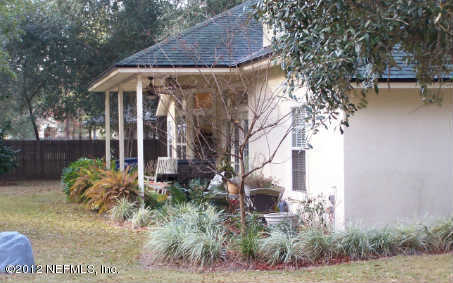97285 Castle Ridge Drive Yulee, FL 32097 - Photo 23 of 23 a front view of a house with garden