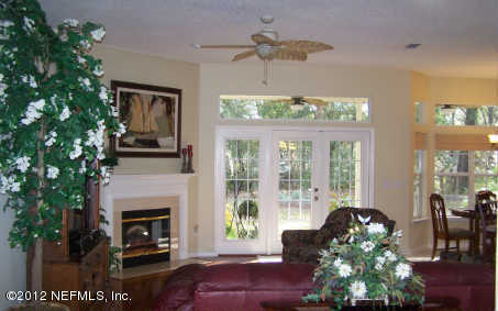 97285 Castle Ridge Drive Yulee, FL 32097 - Photo 4 of 23 a living room with furniture and a fireplace