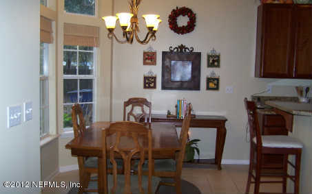 97285 Castle Ridge Drive Yulee, FL 32097 - Photo 5 of 23 a view of a dining room with furniture