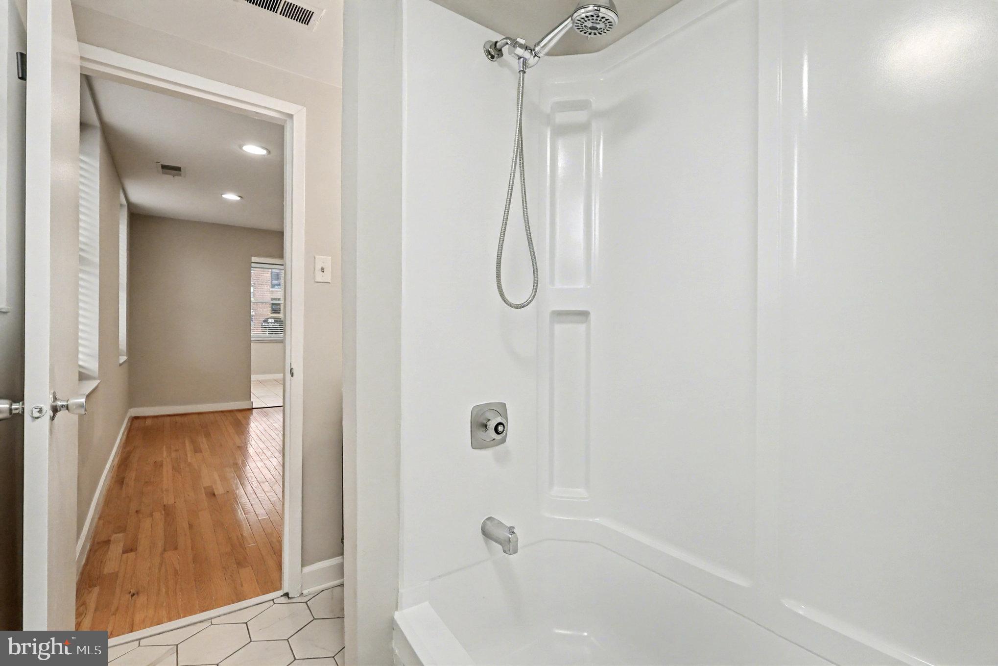 66 New York Avenue Northwest, Unit 206 Washington, DC 20001 - Photo 11 of 24 a bathroom with a bathtub