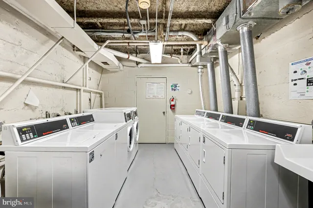 a front view of a house with a yard and outdoor seating