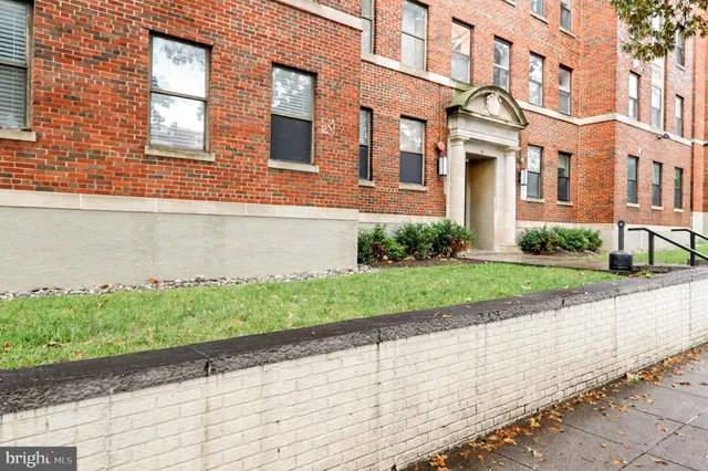 a brick building with a view of street