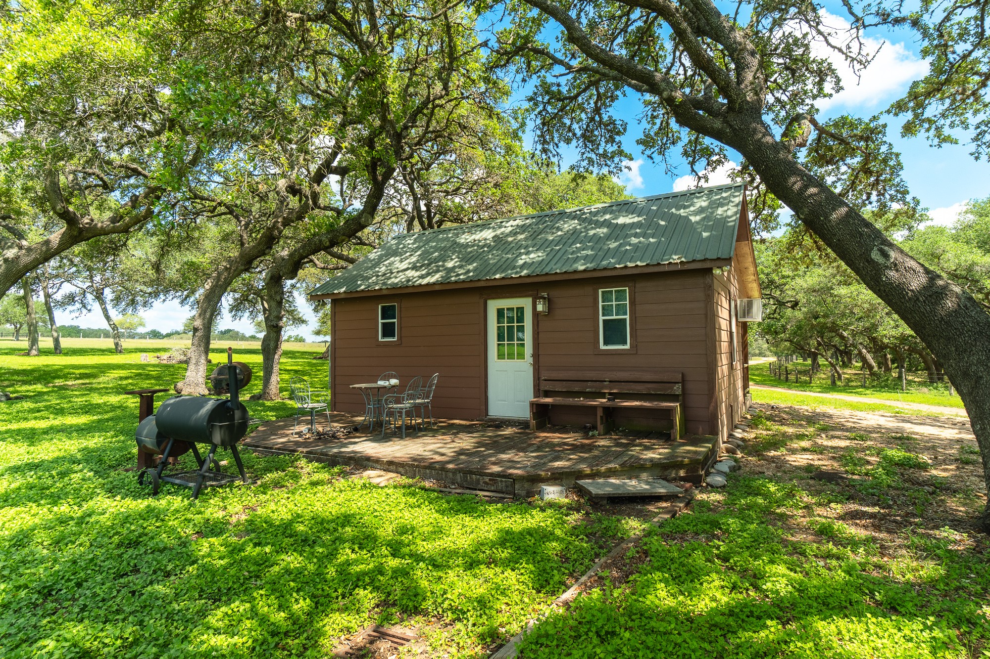 5018 Wolters Road Schulenburg, TX 78956 - Photo 25 of 39 a view of a backyard with table and chairs and a large tree