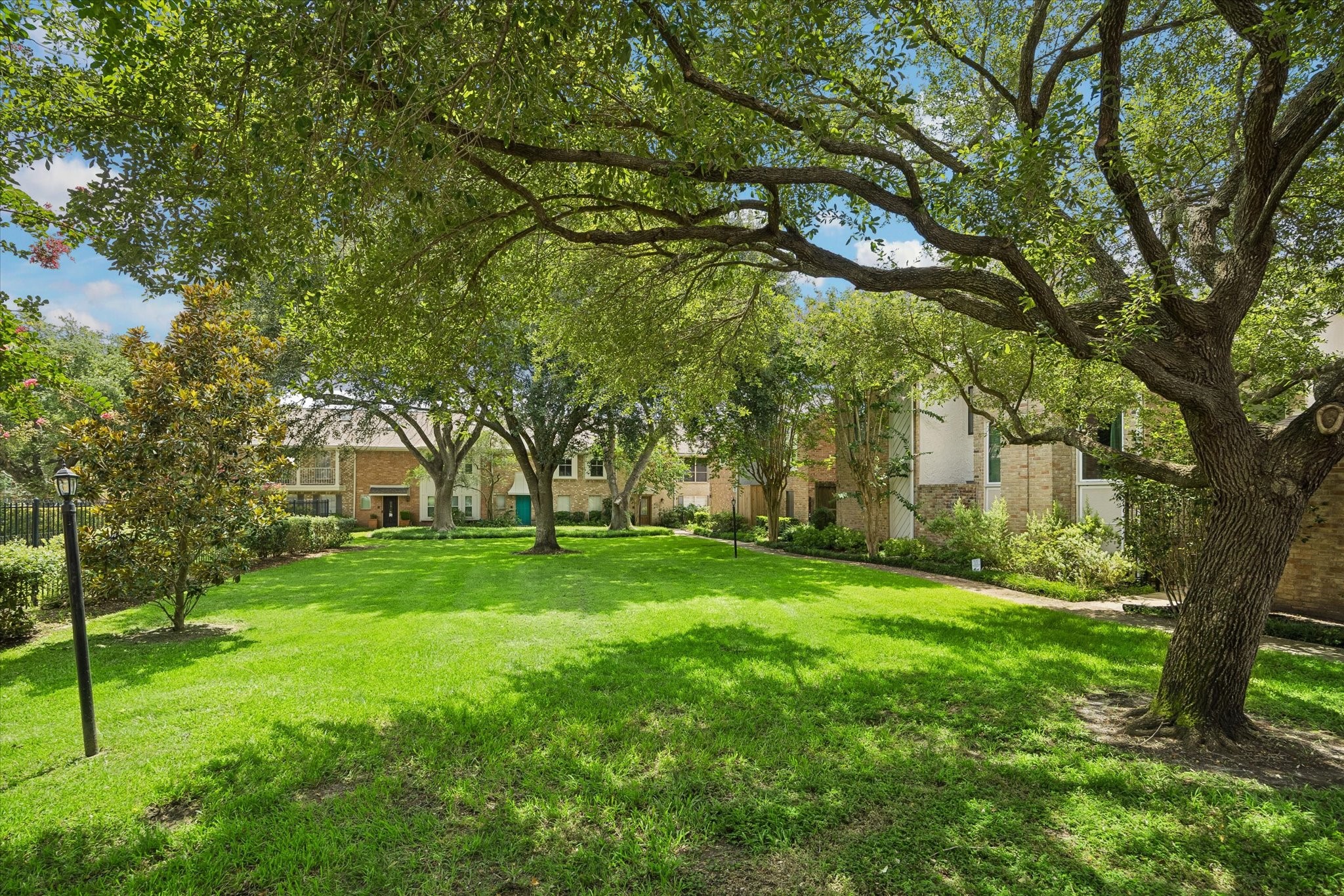 727 Bunker Hill Road, Unit 92 Houston, TX 77024 - Photo 44 of 50 COMMUNITY OF BUNKER HILL TOWNHOMES IS SURROUNDED BY LUSH FOLIAGE & MAJESTIC TREES!