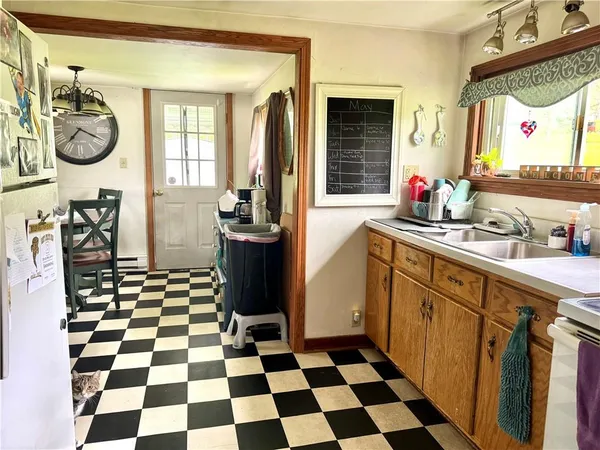 a kitchen with a checkered floor and a black white checkered floor