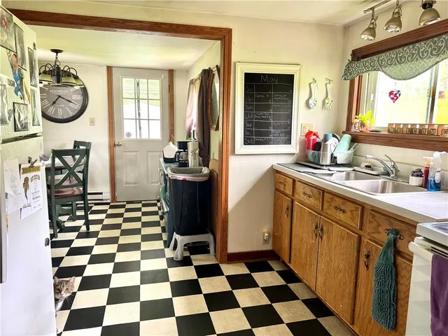 a kitchen with a checkered floor and a black white checkered floor