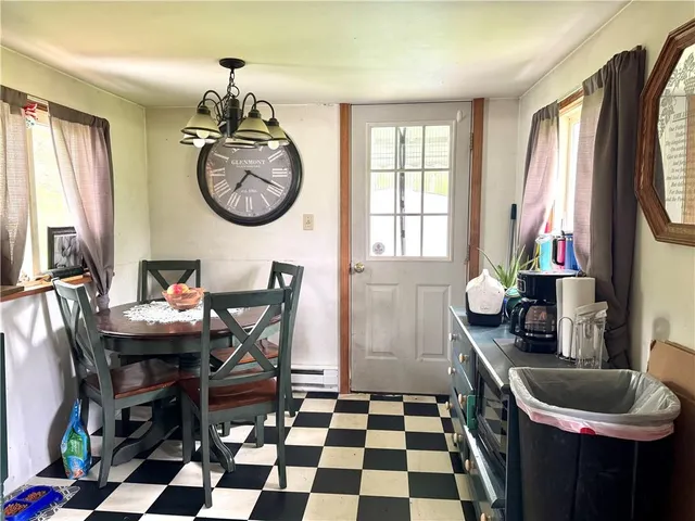 a bedroom with a bed and a mirror