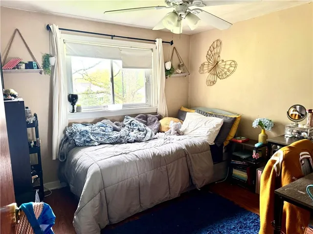 a bedroom with bed and a window