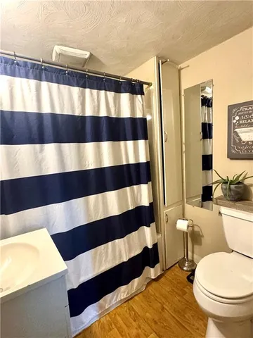 a bedroom with bed and window