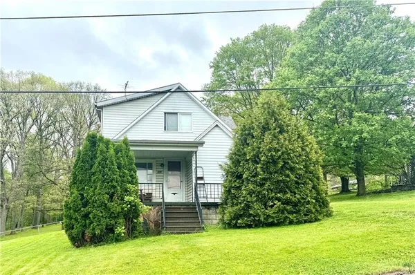a kitchen with a stove a refrigerator and a sink