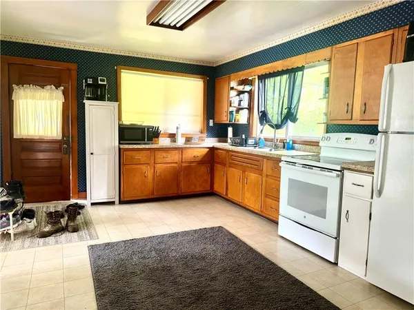 a view of a dining room with furniture and a window