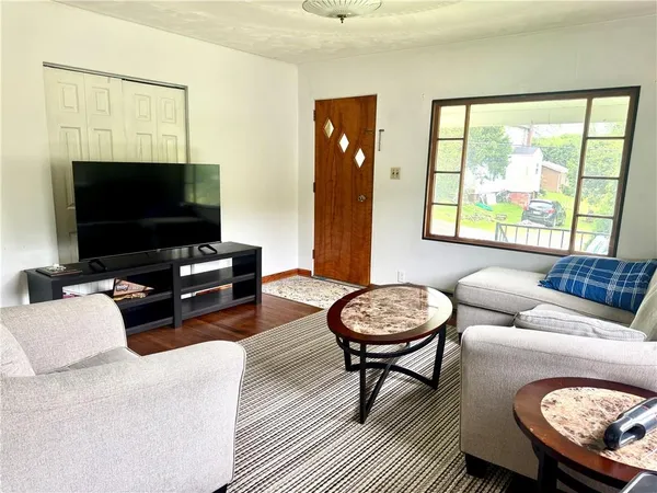 a living room with furniture and a gate