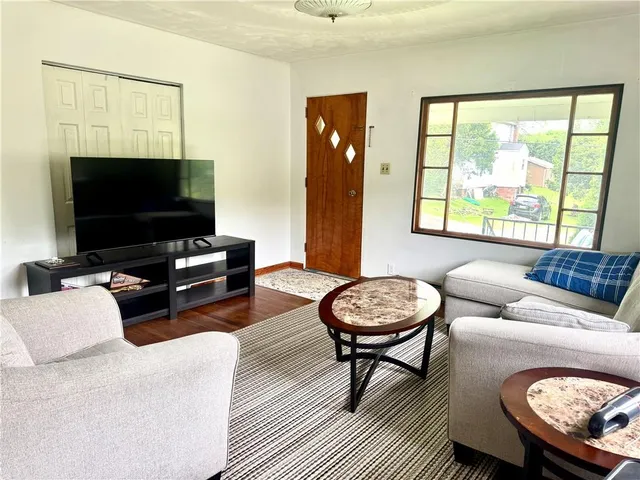 a living room with furniture and a gate