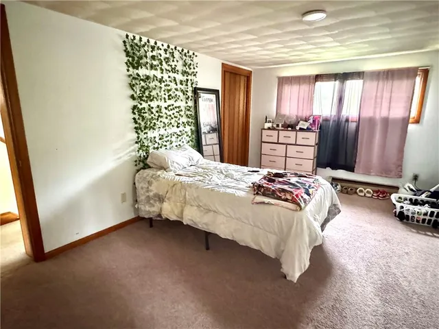 a view of a room with furniture and a window