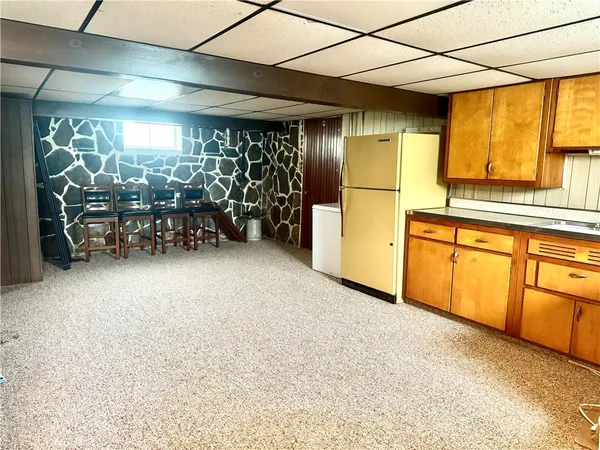 a view of bathroom with a sink and a mirror