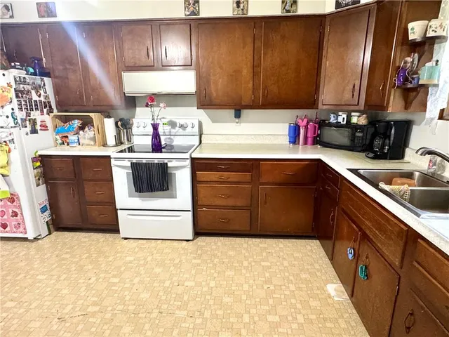 a kitchen with a cabinets and appliances