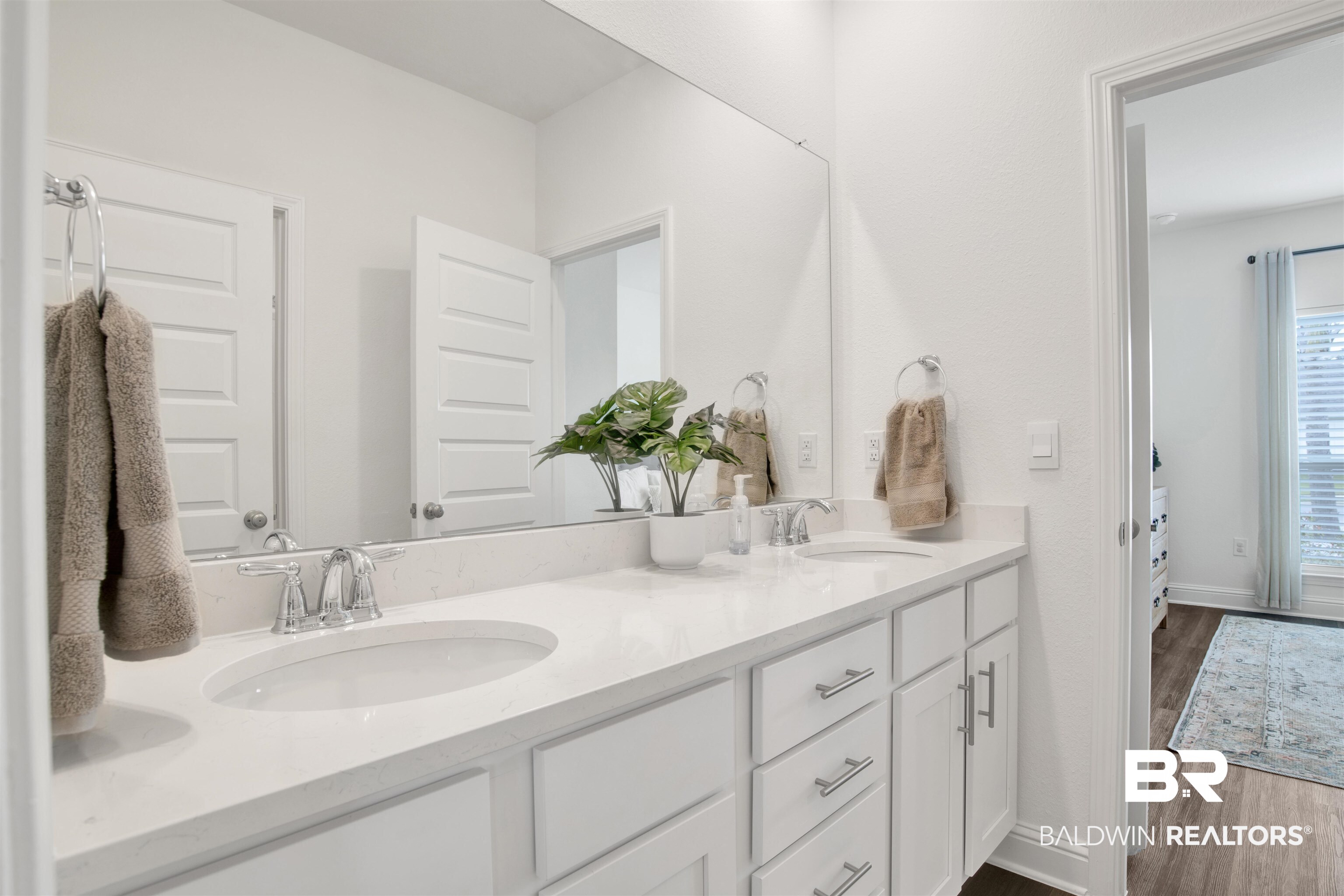 594 Shepard Street Gulf Shores, AL 36542 - Photo 6 of 51 Full bathroom featuring double vanity and dark wood-style floors
